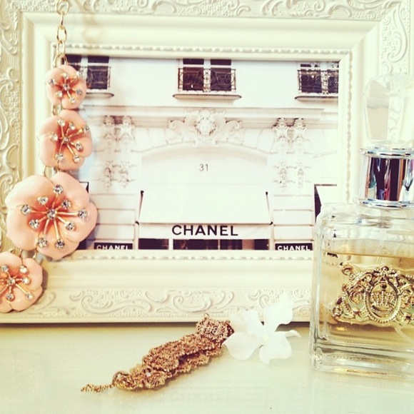 photograph of chanel 31 chanel paper flower wall